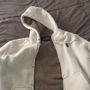 An polo assn jacket with fur in it